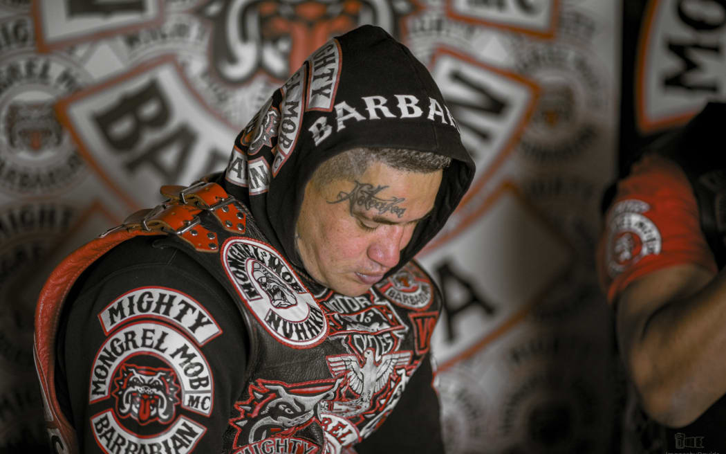 Davide Conti's photographic series 'The Patch' portrays members of the Mongrel Mob in Hawke's Bay striking intentional poses of collective resilience along with approachable casualness.