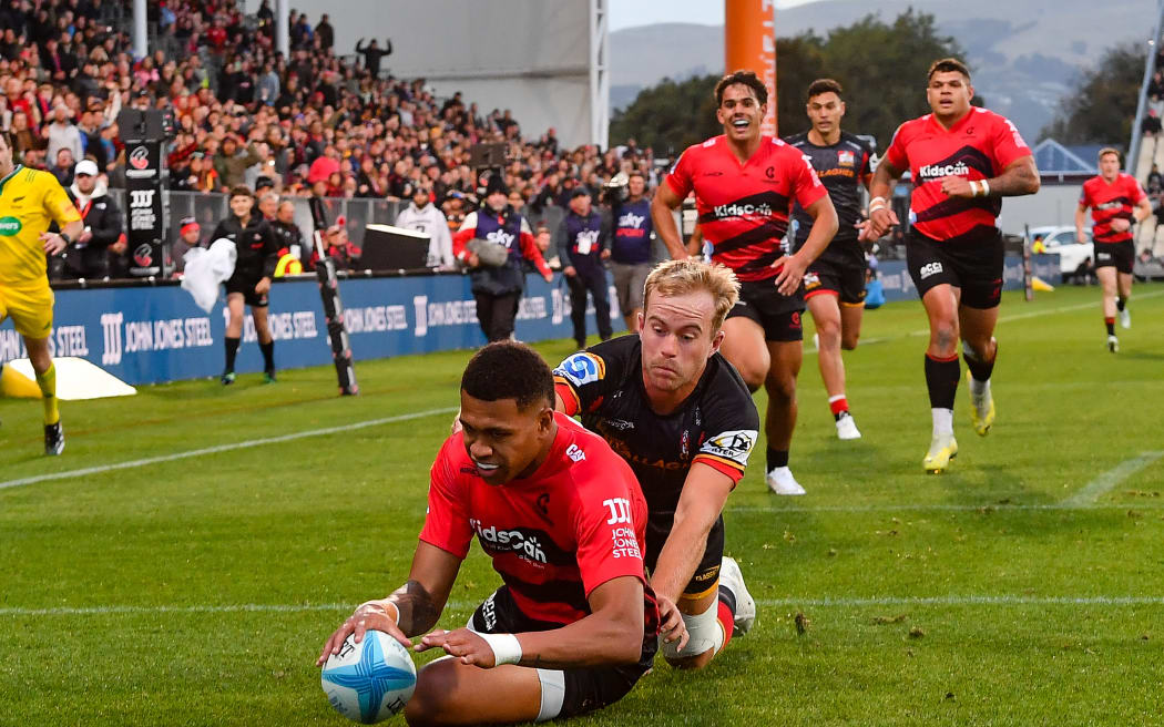 Chay Fihaki of the Crusaders scores a try in the tackle of  Xavier Roe of the Chiefs during the Super Rugby Pacific match, Crusaders Vs Chiefs, at the Apollo Projects Stadium, Christchurch, New Zealand, 29th March 2024. Copyright photo: John Davidson / www.photosport.nz