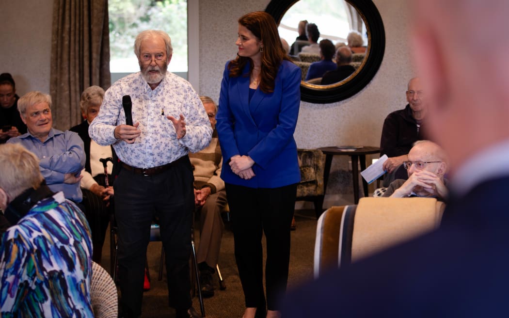 A Malvina Major retirement resident speaks to National leader Christopher Luxon while deputy leader Nicola Willis stands by.