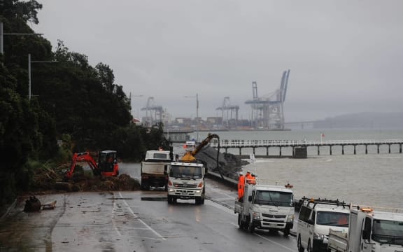 Workers clear a large slip on Tamaki Drive between Okahu Bay and Mission Bay.