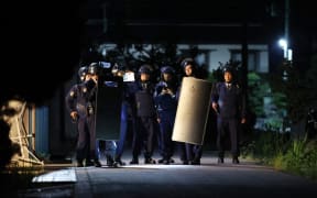 Armed police officers prepare to storm near the house where a suspect has barricaded himself with a hunting gun in Nakano City, Nagano Prefecture on May 26, 2023. According to the local police office, two police officers and one female were confirmed killed. The man killed two male police officers by firing what appeared to be a hunting rifle and a woman by an edged tool and holed himself up inside a building on the previous day. The police officers secured the man when he came outside by himself a little after 4:30 a.m. on the same day, and transported him to the Nakano Police Station.( The Yomiuri Shimbun ) (Photo by Hiroto Sekiguchi / Yomiuri / The Yomiuri Shimbun via AFP)