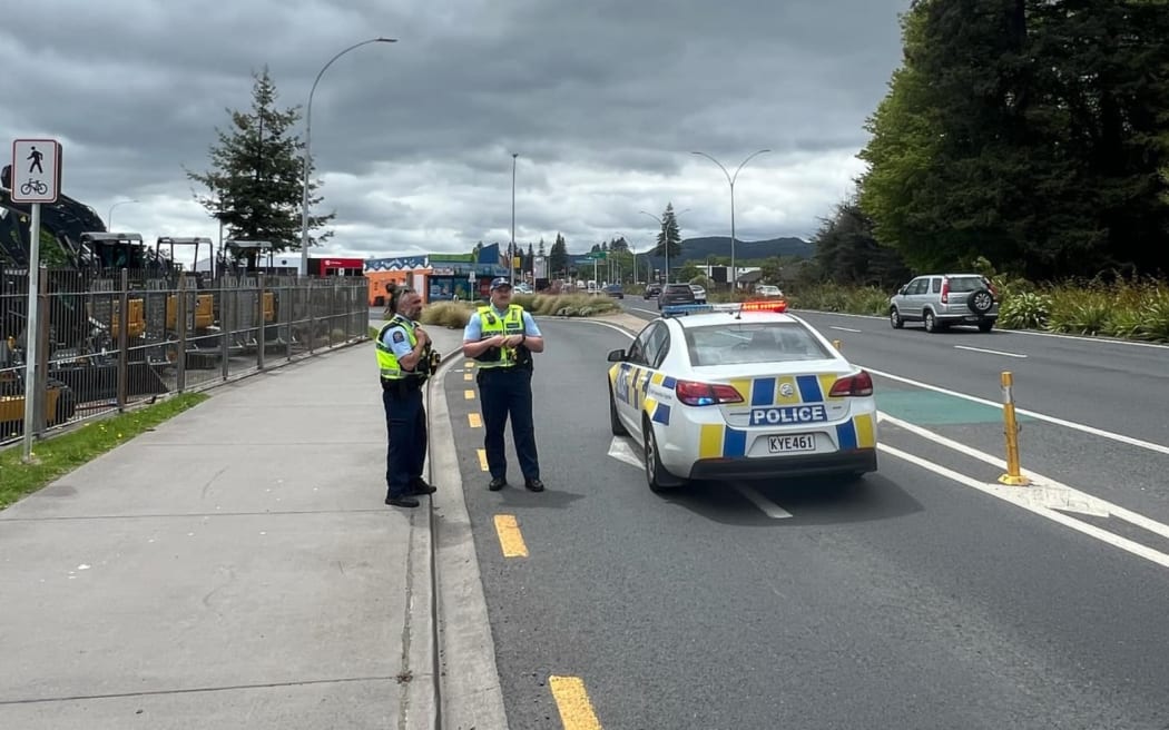A police roadblock on Te Nae Road as emergency services attend a motor vehicle accident on Vaughan Road, Rotorua.