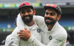 Ajinkya Rahane and Virat Kohli of India embrace each other.