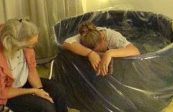 Midwife Sharon Robinson supporting Lauren birthing at home.
