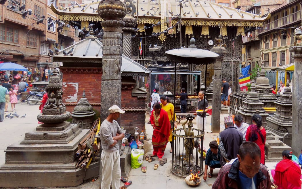 Temples and people in ancient square