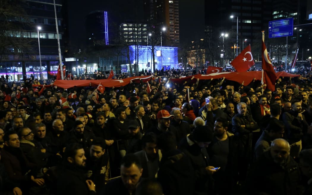 Turkish citizens gather outside Turkish consulate in Rotterdam to protest Dutch government after its ban on ministers, in Rotterdam,