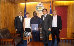 Solomon Islands Prime Minister Manasseh Sogavare (middle) with representatives of Crimson Petroleum.