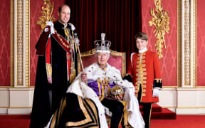 The King and his son and grandson were pictured on Coronation day in Buckingham Palace.