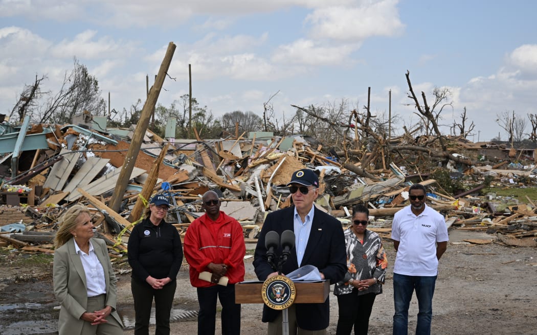 US President Joe Biden speaks during a press conference in a storm-stricken area of Rolling Fork, Mississippi, on March 31, 2023. - The Bidens are visiting Rolling Fork, Mississippi, a week after it was devastated by a tornado that ripped through the southern state, killing at least 25 people. (Photo by Mandel NGAN / AFP)