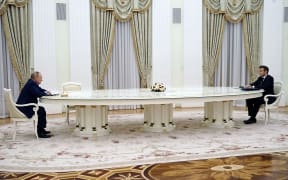 French President Emmanuel Macron (right) meets with Russian President Vladimir Putin in Moscow on February 7, 2022, for talks in an effort to find common ground on Ukraine and NATO.
