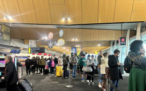 A very long queue at Wellington Airport in line for special assistance after more than 50 flights in and out of the capital were cancelled due to low lying cloud on 21 November 2023.
