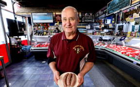 Westmere Butchery owner David Rossiter with his 2025 winning sausage.