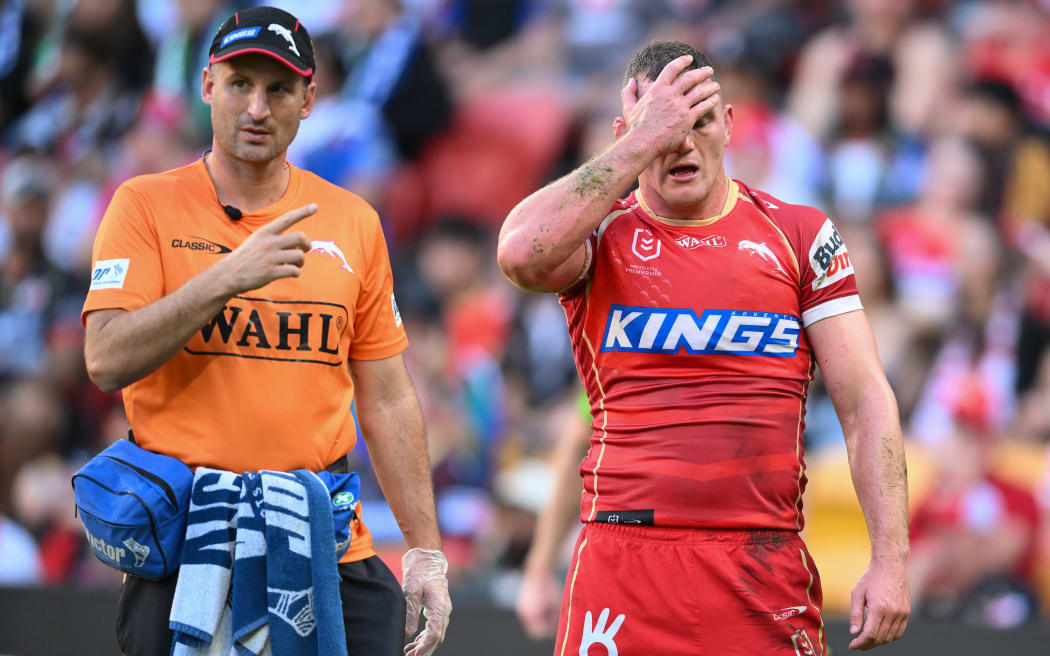 Tom Gilbert (captain) of the Dolphins comes off with injury, Dolphins v Warriors.