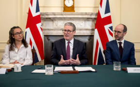Britain's Prime Minister Keir Starmer (C) holds a roundtable meeting with Sarah Simpkin from the Children's Society (L) and writer Jack Thorne (R) of "Adolescence", inside 10 Downing Street on March 31, 2025 in London. "Adolescence", the Netflix hit series about a British 13-year-old boy arrested on suspicion of a horrifying crime, has intensified the anxiety of parents worried about toxic and misogynistic influences young people are exposed to online. (Photo by Jack Taylor / POOL / AFP)