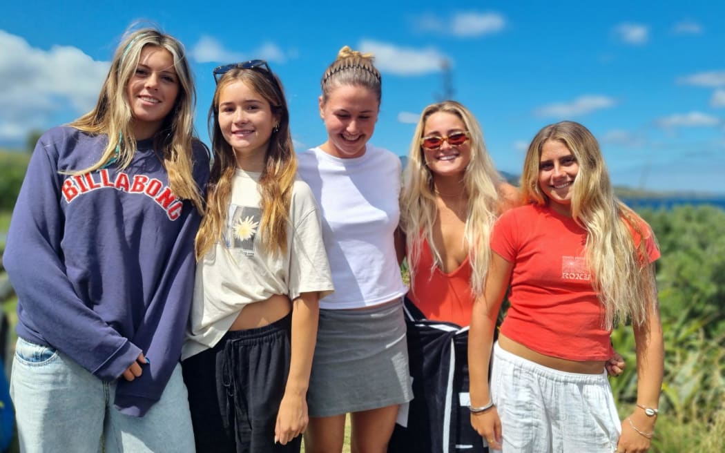 Phia surfer Leia Millar, second left, and her mates are looking forward to taking on NZ women's surfing legend Paige Hareb at the National Surfing Championships in Taranaki this week.