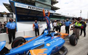 Scott Dixon reacts to winning the pole for the 105th running of the Indianapolis 500 on May 23, 2021 at the Indianapolis Motor Speedway in Indianapolis, Indiana.