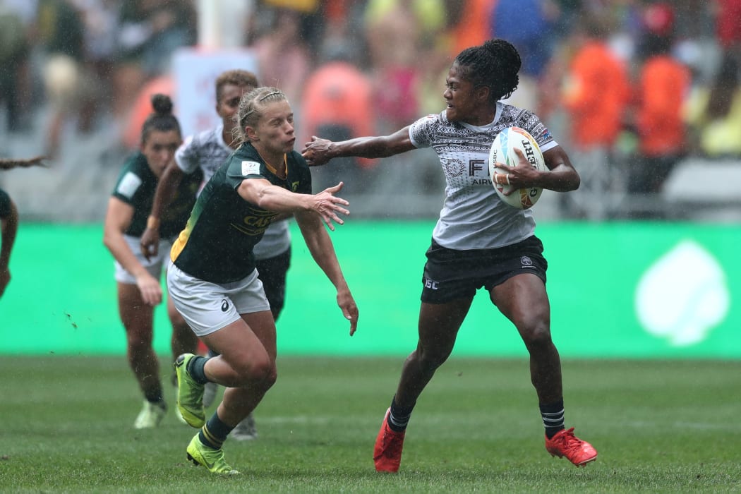 Fiji's Tokasa Seniyasi fends off the South Africa defence during the inaugural Cape Town Women's Sevens.