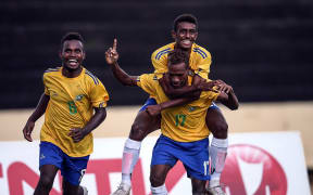 The Solomons team celebrates as they defeat Fiji