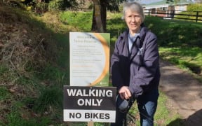 Jessica Maxwell with a walking only sign at Tainui Reserve in Havelock North.