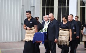 Bill Sevesi's family carries his coffin at his funeral in Auckland.