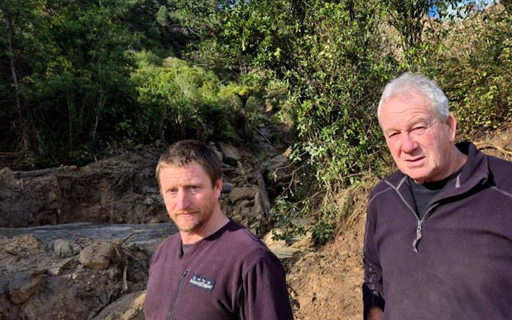 Byron McEnroe and friend Parrish Hurley have spent the past couple of days working to repair the driveway to McEnroe's mother's house.
