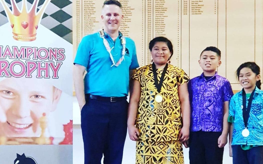 NZ Chess Power's Paul McDonald with the Po'e-Tofaeono siblings.