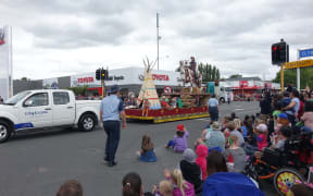 The Ojibwe costumes were removed from the float after complaints, but the cowboys and horses remained.