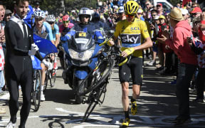 Chris Froome was forced to run up the slopes of the Mont Ventoux briefly