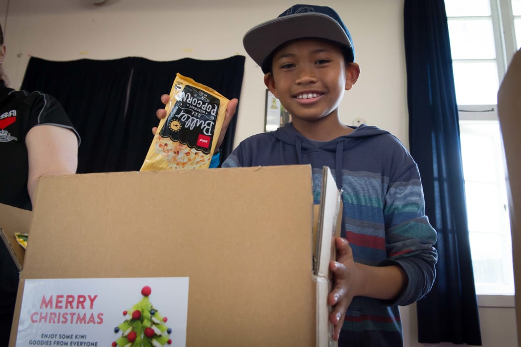 About 40 schoolchildren, veterans, staff from Foodstuffs and Z Energy, and New Zealand Defence Force personnel packed hundreds of Christmas treats this morning for NZDF personnel serving overseas.