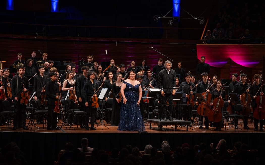 Madison Horman (soprano), NZSO National Youth Orchestra, Adam Johnson (conductor) onstage at Wellington's Michael Fowler Centre.