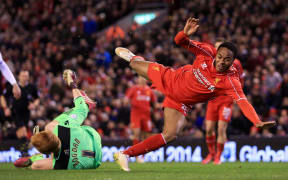 Liverpool winger Raheem Sterling comes off second-best to Bolton goalkeeper Adam Bogdan