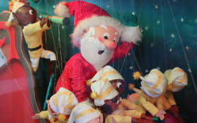 Elves in the window of Smith and Caughey's Christmas display in 2023.