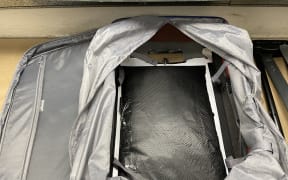 Customs officials found 3.25kg of cocaine in the lining of a suitcase at Auckland International Airport.