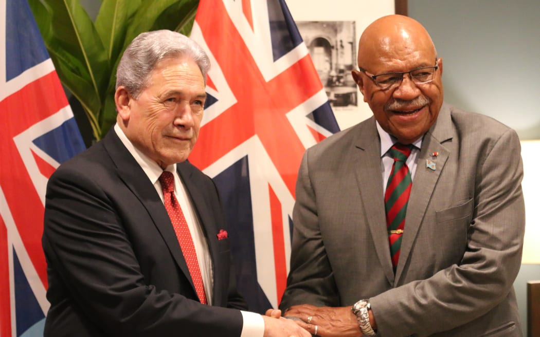 Fiji prime minister Sitiveni Rabuka shakes hands with NZ deputy prime minister Winston Peters ahead of their bilateral meeting in Suva on 15 December, 2023.
