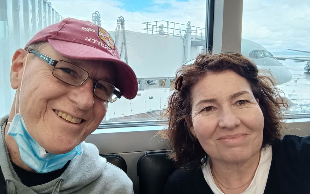 David Cotton and his partner Lucy waiting for their flight to Germany so David can begin his cancer treatment.