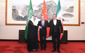 Wang Yi (centre), a member of the Political Bureau of the Communist Party of China (CPC) Central Committee and director of the Office of the Foreign Affairs Commission of the CPC Central Committee, attends a closing meeting of the talks between the Saudi delegation led byMusaed bin Mohammed Al-Aiban (left), Saudi Arabia's Minister of State, Member of the Council of Ministers and National Security Advisor, and Iranian delegation led by Admiral Ali Shamkhani (right), Secretary of the Supreme National Security Council of Iran, in Beijing, China, 10 March, 2023.