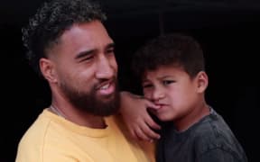 ASD Dads support group founder, Jordan Ikitule with his son.