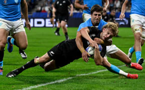 Alln Blacks back Damian McKenzie scores against Uruguay at the Rugby World Cup.