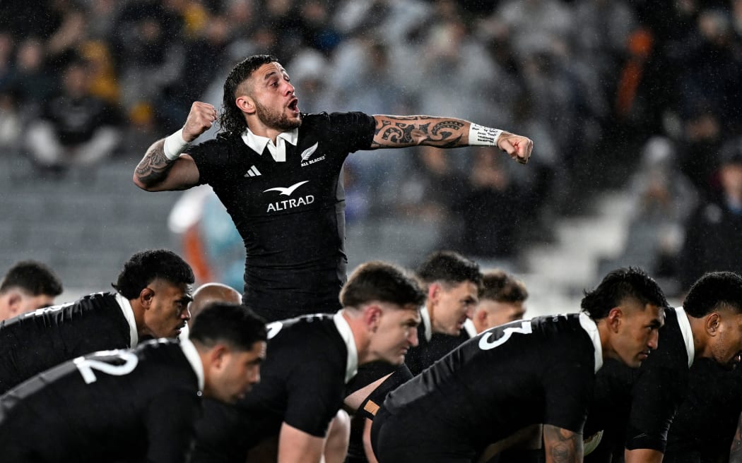 TJ Perenara of New Zealand leads the haka.