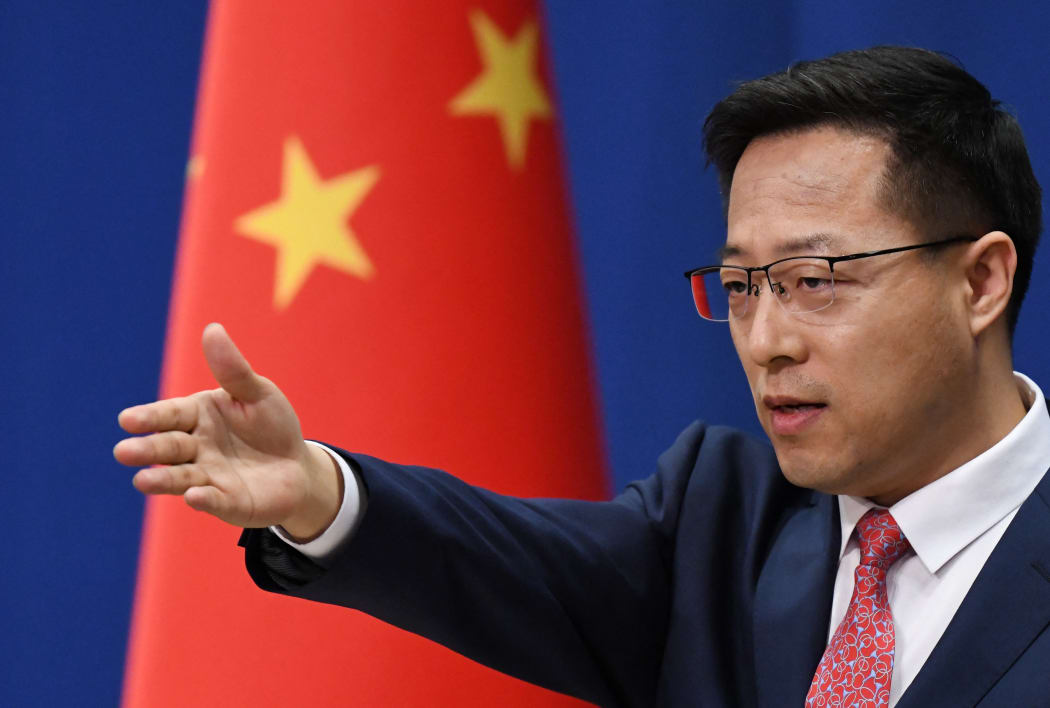 Chinese Foreign Ministry spokesman Zhao Lijian takes a question at the daily media briefing in Beijing on April 8, 2020. (Photo by GREG BAKER / AFP)