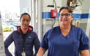 Hospital Security person Irene and registered nurse Wendy Thompson deliver the first of the COVID-19 vaccines to the Sulphur Point.