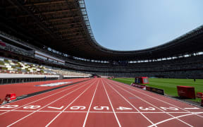 A general view shows the National Stadium, main venue for the Tokyo 2020 Olympic and Paralympic Games, in Tokyo on May 9, 2021. (Photo by Charly TRIBALLEAU / AFP)