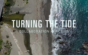 Drone shot of a coastline. Text reads "Turning The Tide: Collaboration in action"
