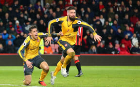Olivier Giroud (R) and Gabriel Paulista of Arsenal celebrate a goal.