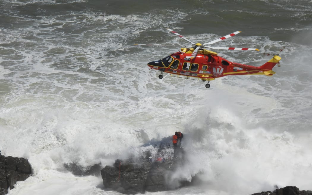 Two fishermen were rescued after facing large swells and becoming trapped on rocks at Sunset Beach on 29 January, 2024.