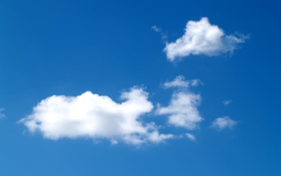 An image of a blue sky with some clouds.