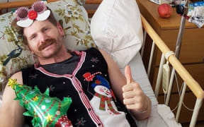 Adam Thomson recovers in hospital in Tokyo.