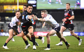 Rivez Reihana of the Crusaders makes a break.