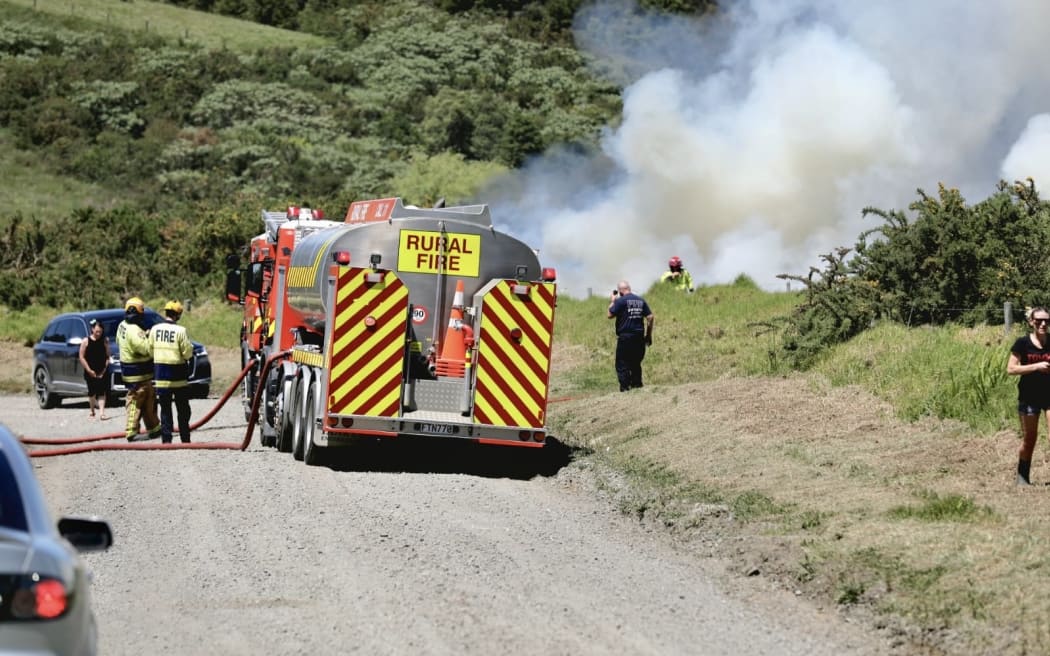 Firefighters battle a blaze in Millwater, Auckland, on 7 November 2025.