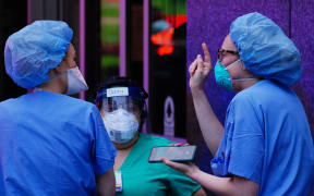 Nurses take a break on their shifts at NYU Langone Hospital in New York City, USA, during coronavirus pandemic on April 10, 2020. (Photo by John Nacion/NurPhoto)